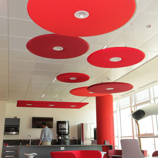 Coloured acoustic panels with led and round shape in a coffee bar