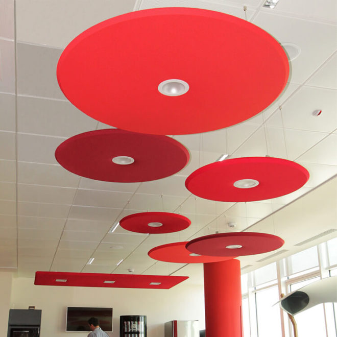 Coloured sound absorbing panels with round shape for the cafe