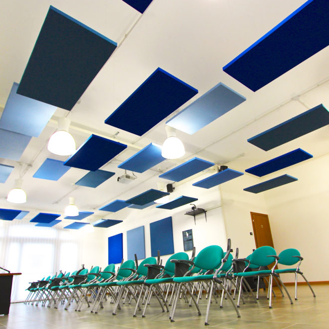 Sound proofing ceiling panels in a conference room