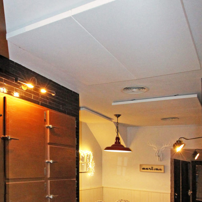 White acoustic panels on the ceiling of a restaurant