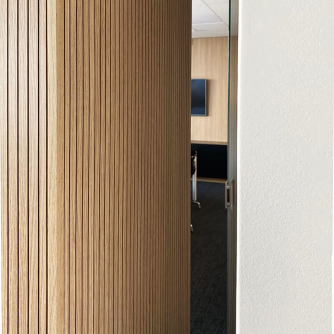 Wooden slatted wall panels for a office