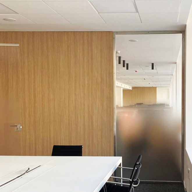Wooden acoustic wall coating for a meeting room