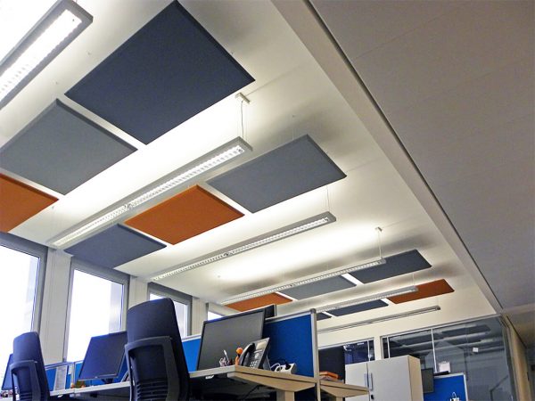 Acoustic panels suspended from the ceiling for workspaces