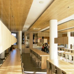 Sound absorbing false wooden ceiling in a canteen