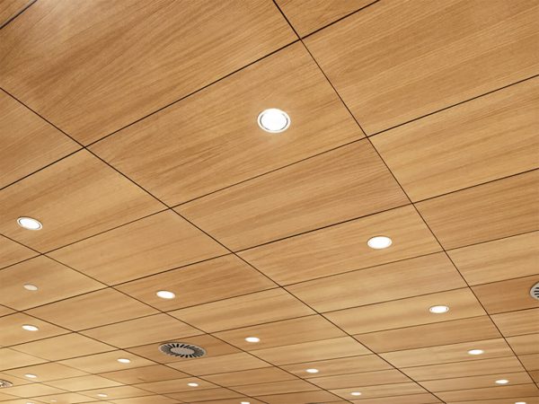 Microperforated sound absorbing wood on the ceiling with lamps