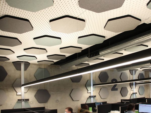 Sound absorbing wall and ceiling panels in a call center