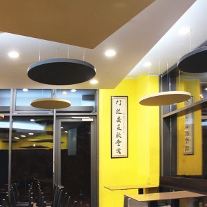 Sound absorbing panel suspended from the ceiling in a restaurant