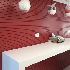 Red milled wooden acoustic wall panels for public spaces