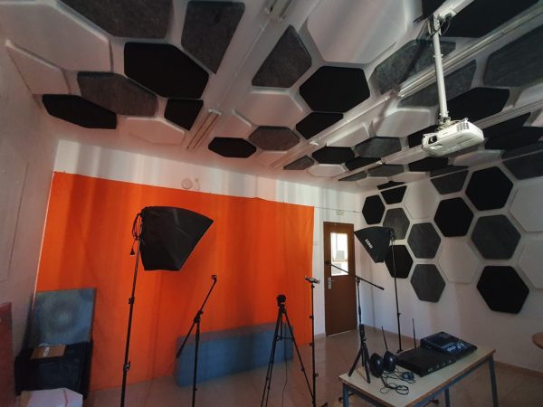Economical acoustic panels in a recording room in a school