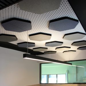 Office acoustic correction with sound absorbing ceiling panels