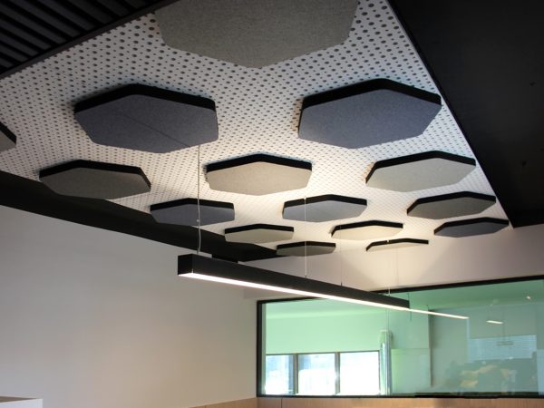Office acoustic correction with sound absorbing ceiling panels