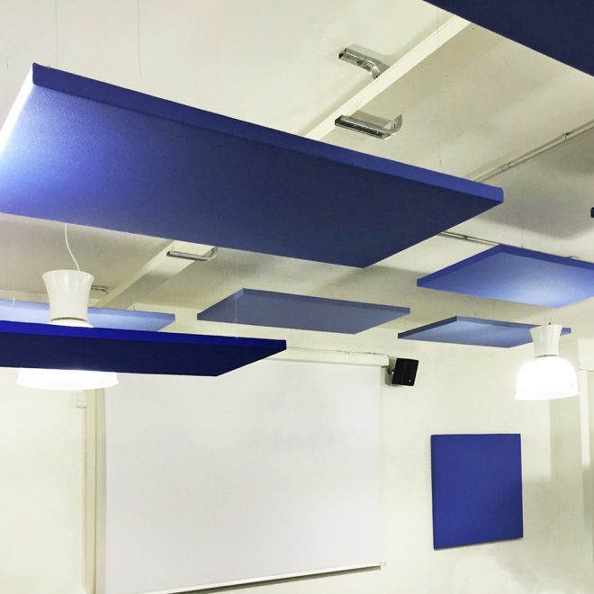 Suspended soundproofing blue panels in a classroom