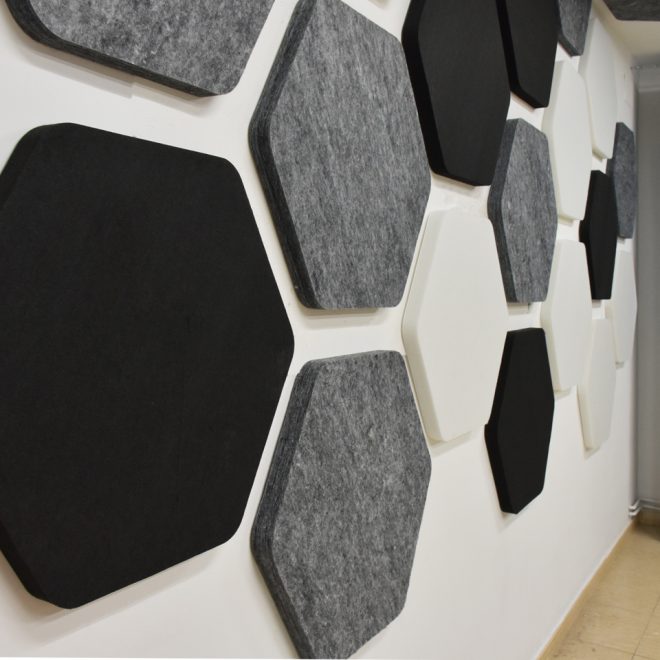 Grey white and black sound proofing panels in polyester fiber on the wall